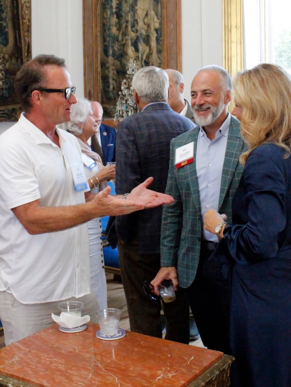 Jenny Costa Honeycutt speaking with attendees in a photo attached to the Facebook post.