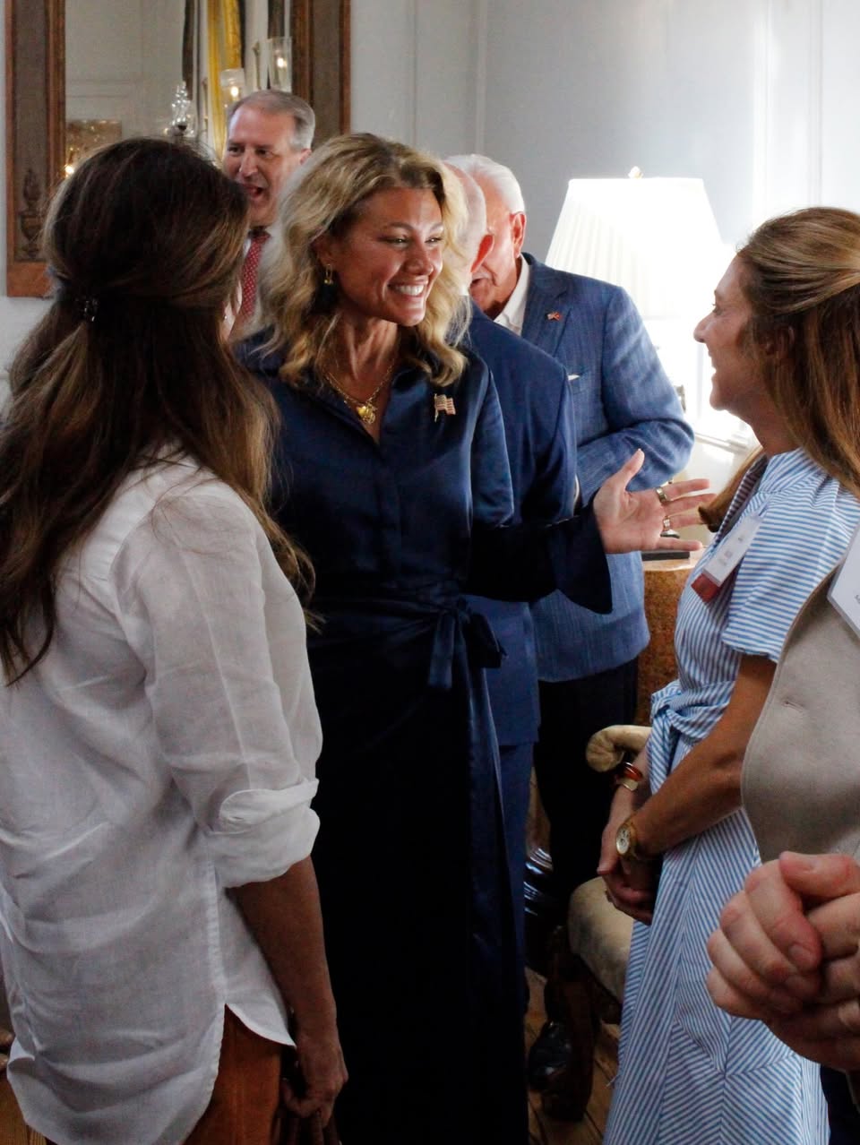 Jenny Costa Honeycutt greeting attendees with Steve Scalise visible in the background in a photo attached to the Facebook post.