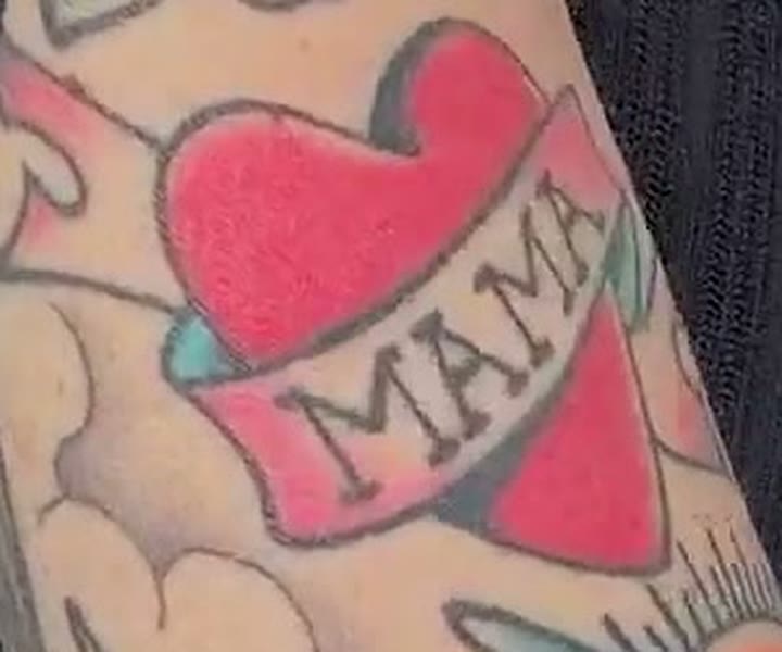 Close-up of a traditional red heart tattoo wrapped in a banner reading MAMA on Nancy Mace's forearm, from TMZ's September 1, 2026 Capitol Hill clip.