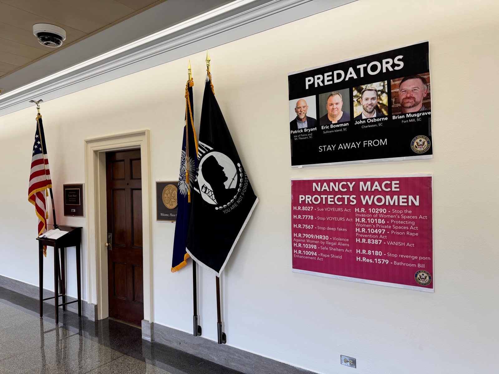 The 'PREDATORS' poster outside her office (Feb.-Nov. 2025), image 3