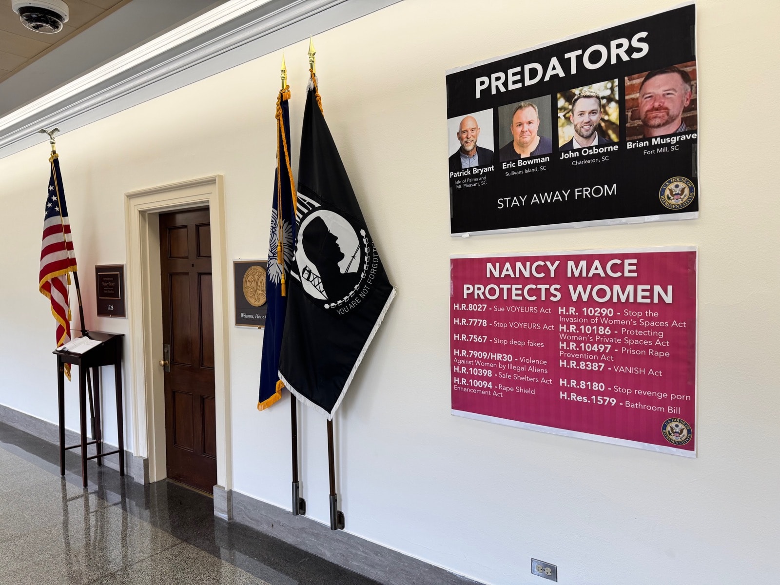 The 'PREDATORS' poster outside her office (Feb.-Nov. 2025), image 2